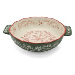 Green porcelain baking dish with handles, cream interior, and red floral patterns on a white background - view 3