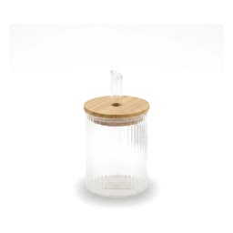 Clear ribbed glass oil dispenser bottle with a light wood lid and a clear glass spout, filled with yellow olive oil, on a wh… - view 2