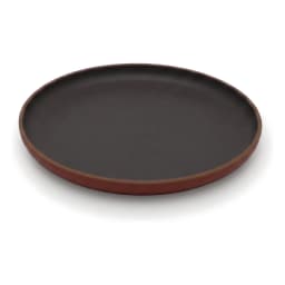 Round melamine plate with a dark grey/black matte surface and a terracotta brown rim, on a white background. - view 2