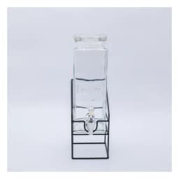 Clear rectangular glass beverage dispenser with a silver spigot and a matching glass lid, sitting on a black wire metal stan… - view 2