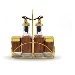 Four-piece clear glass oil and spice set with gold tops and wood-look labels, in a gold metal stand on a white background. - view 3
