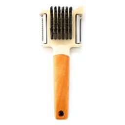 White plastic and wood handle vegetable peeler and scrubber with black bristles, surrounded by fresh carrots and potatoes on… - view 3