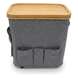 Grey fabric storage hamper with a light brown bamboo wood lid and three front pockets, on wheels. - view 2