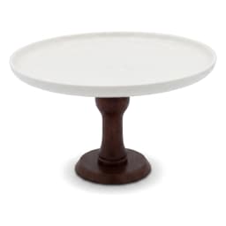 White porcelain cake stand with a dark brown wooden pedestal base on a white background, viewed from a slight angle. - view 3
