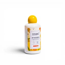 White plastic bottle with a bright yellow spherical cap, featuring a yellow and orange label with citrus fruit illustrations… - view 2