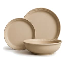 Three beige porcelain dinnerware pieces: a large dinner plate, a smaller salad plate, and a deep bowl, all with ribbed edges. - view 2