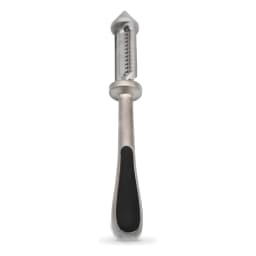 Silver metal vegetable peeler with a black handle peeling an orange carrot on a beige kitchen counter - view 2
