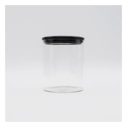 Clear cylindrical glass storage jar with a black screw-on lid on a white background - view 3