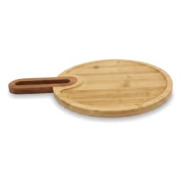 Light brown round bamboo wood cutting board with an integrated rectangular handle, viewed at an angle on a white background. - view 3