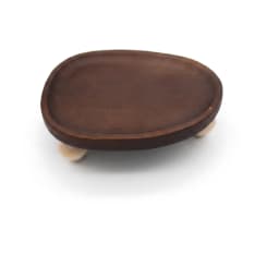 Dark brown wooden oval serving tray with three light natural wood geometric legs on a white background. - view 2