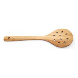 Light brown wooden slotted spoon with multiple drainage holes and a hanging hole on the handle, on a white background. - view 2