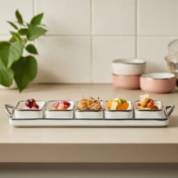 Cream porcelain serving set with five square bowls and a rectangular tray, all with silver trim, on a white background. - view 6