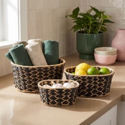 Set of three oval Khous storage baskets in black and natural beige woven pattern, stacked on a white background. - view 6