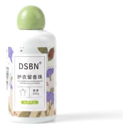 White bottle of clothing fragrance beads with green cap, floral label, 230g, on a light brown shelf. - view 2