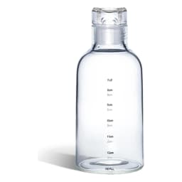 Clear acrylic water bottle with white lid and black time markings on a kitchen counter next to pink mugs. - view 2