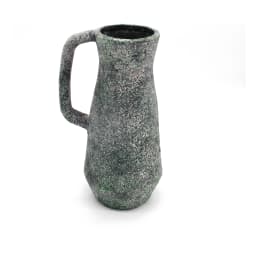 Single dark grey and green speckled porcelain pitcher with a handle on a white background, showing rustic texture. - view 2