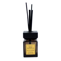 Square dark brown glass reed diffuser with black wooden cap and black reeds on a white background. - view 2
