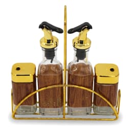 Four-piece clear glass oil and spice set with gold tops and wood-look labels, in a gold metal stand on a white background. - view 2