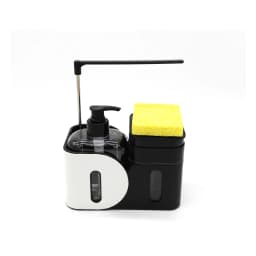 Black and white plastic kitchen sink organizer with a clear soap dispenser, a black sponge holder, and a yellow sponge on a… - view 2