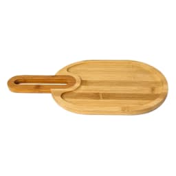 Light brown oval wood serving board with a handle and two recessed compartments on a white background. - view 2