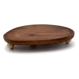 Light brown wood serving tray with an irregular oval shape, featuring natural wood grain, on a white background. - view 3
